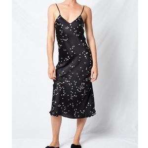 Black slip dress with star pattern